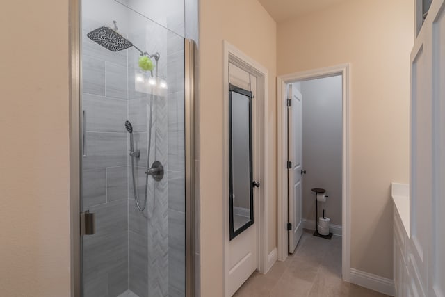 bathroom featuring tile patterned floors and an enclosed shower