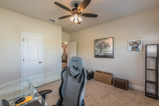 office area with ceiling fan and light carpet