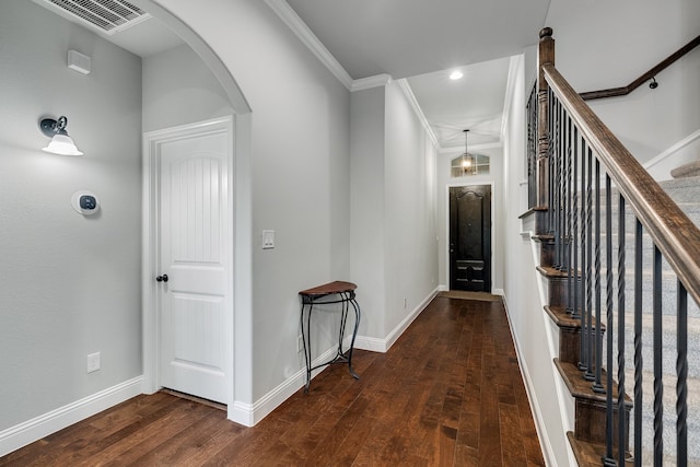 corridor featuring dark hardwood / wood-style flooring and ornamental molding