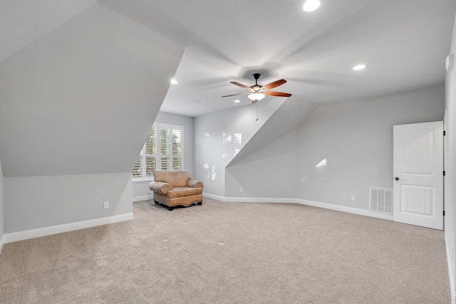 bonus room with light colored carpet, ceiling fan, and lofted ceiling