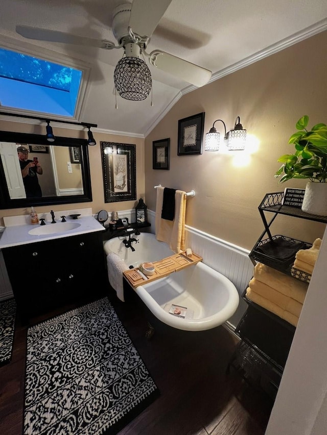 208 Cedar Ln, Burleson, TX 76028 - full bathroom featuring a ceiling fan, vaulted ceiling, wood finished floors, a freestanding tub, and crown molding