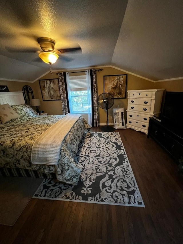 208 Cedar Ln, Burleson, TX 76028 - bedroom with lofted ceiling, wood finished floors, a ceiling fan, and a textured ceiling