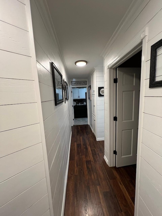208 Cedar Ln, Burleson, TX 76028 - hallway with ornamental molding, dark wood-type flooring, and wooden walls