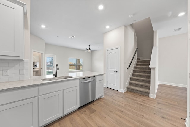 kitchen featuring dishwasher, white cabinetry, ceiling fan, and sink