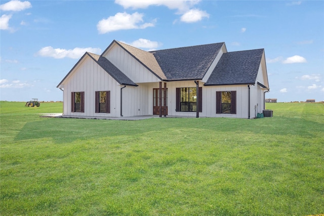 modern farmhouse style home with central AC unit, board and batten siding, a shingled roof, and a front lawn