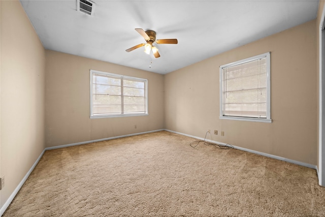 carpeted empty room with ceiling fan