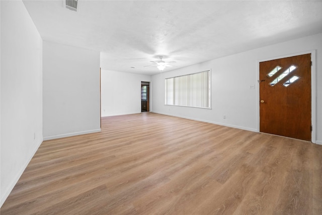 unfurnished room featuring ceiling fan and light hardwood / wood-style flooring