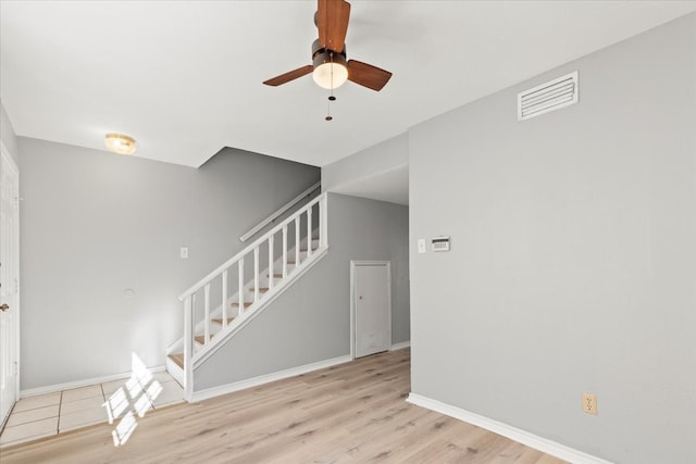 interior space with ceiling fan and light hardwood / wood-style flooring