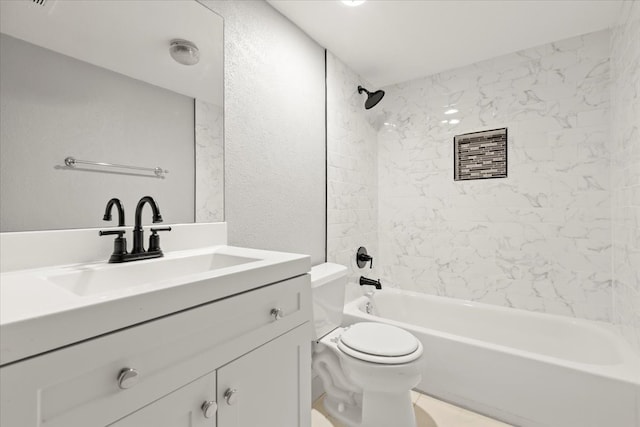 full bathroom with vanity, toilet, and tiled shower / bath