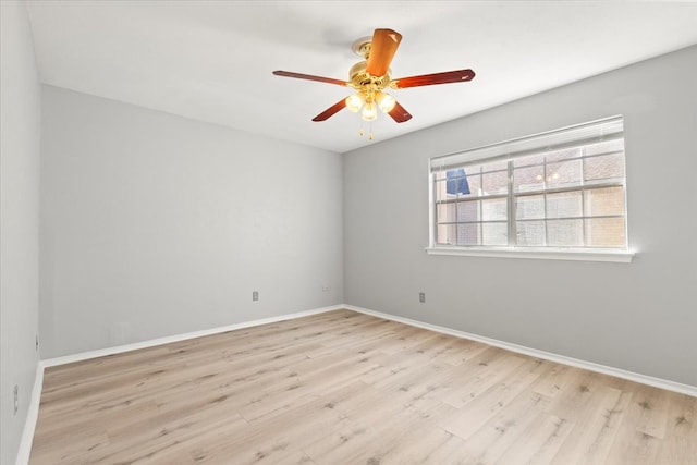 spare room featuring light hardwood / wood-style flooring and ceiling fan