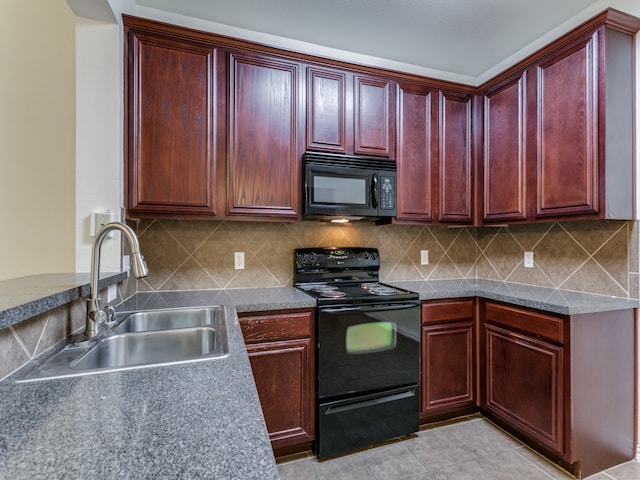 kitchen featuring tasteful backsplash, sink, light tile patterned floors, and black appliances