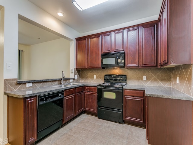 kitchen with stone counters, sink, backsplash, light tile patterned floors, and black appliances