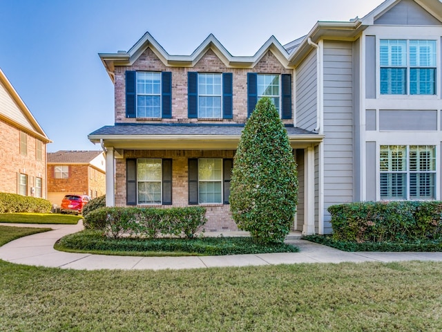 view of front of home with a front lawn