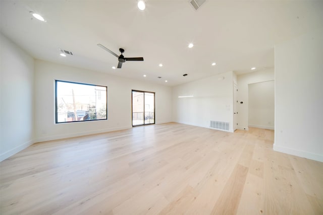 spare room featuring ceiling fan and light hardwood / wood-style flooring