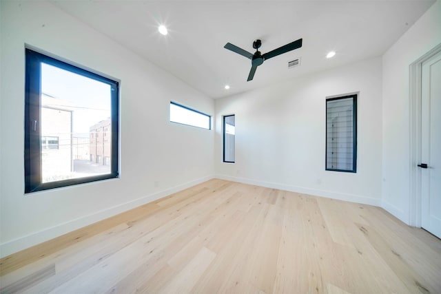 empty room featuring light hardwood / wood-style flooring and ceiling fan