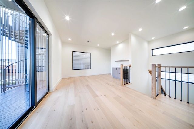 unfurnished living room featuring light hardwood / wood-style flooring