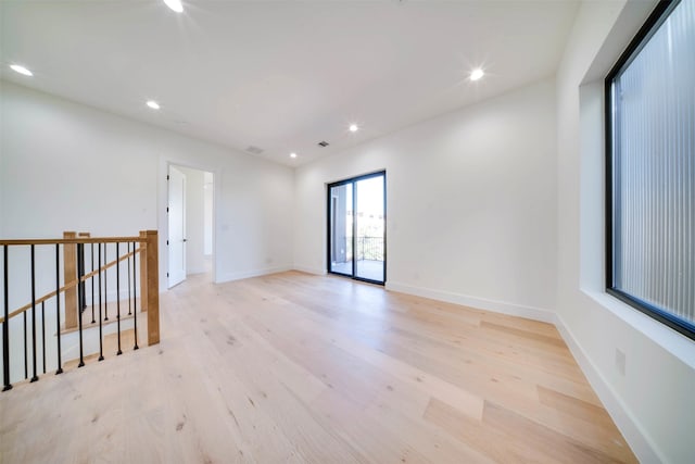 unfurnished room featuring light wood-type flooring