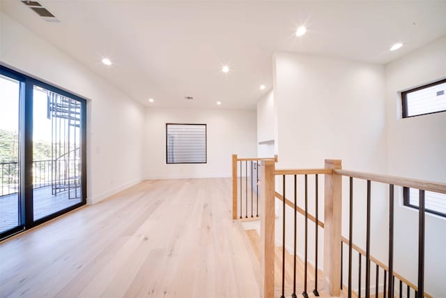 corridor featuring light hardwood / wood-style floors