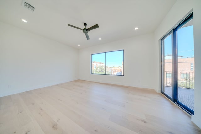 unfurnished room featuring ceiling fan and light hardwood / wood-style flooring