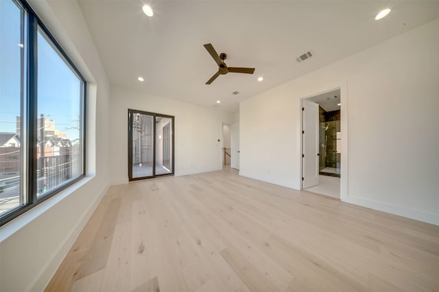 spare room featuring ceiling fan and light wood-type flooring