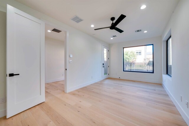 unfurnished room featuring light wood-type flooring and ceiling fan