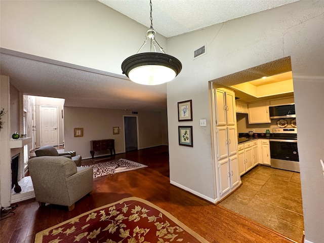 interior space with wood-type flooring and a textured ceiling