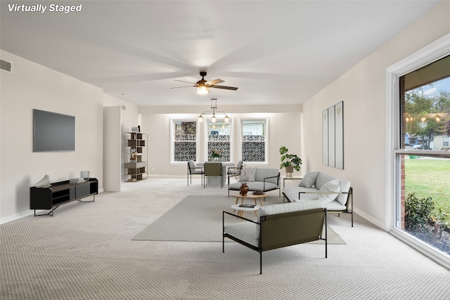 living room featuring light carpet and plenty of natural light