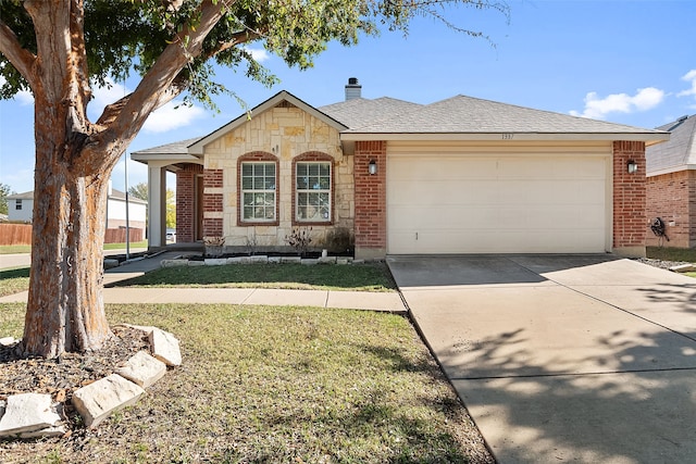 single story home with a front yard and a garage