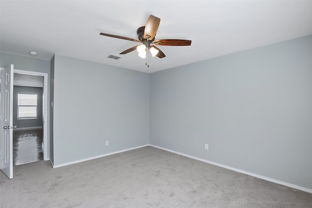 carpeted empty room with ceiling fan