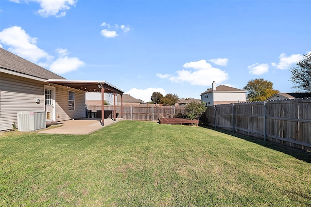 view of yard with cooling unit and a patio area