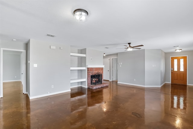 unfurnished living room featuring built in shelves, ceiling fan, and a fireplace