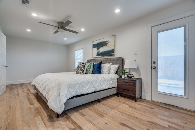 bedroom with ceiling fan and light hardwood / wood-style floors