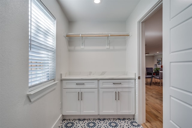 spacious closet with light hardwood / wood-style floors