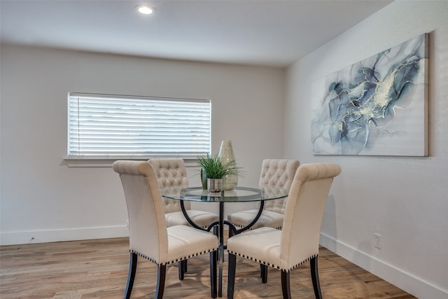 dining room with hardwood / wood-style floors