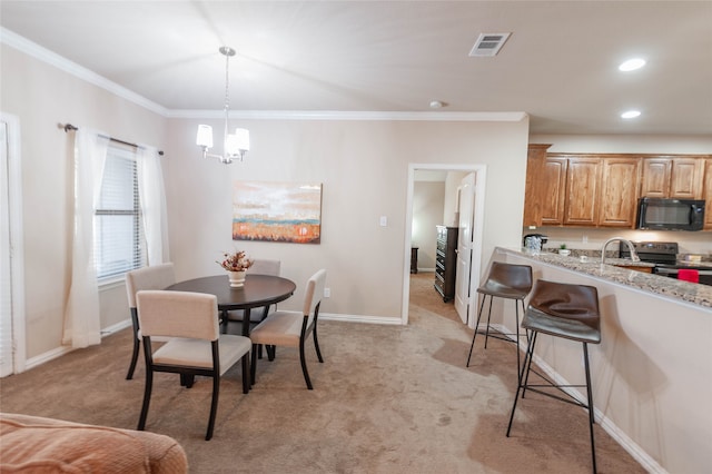 dining space with a chandelier, light colored carpet, and crown molding