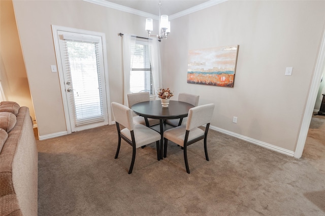 carpeted dining space with a chandelier and ornamental molding