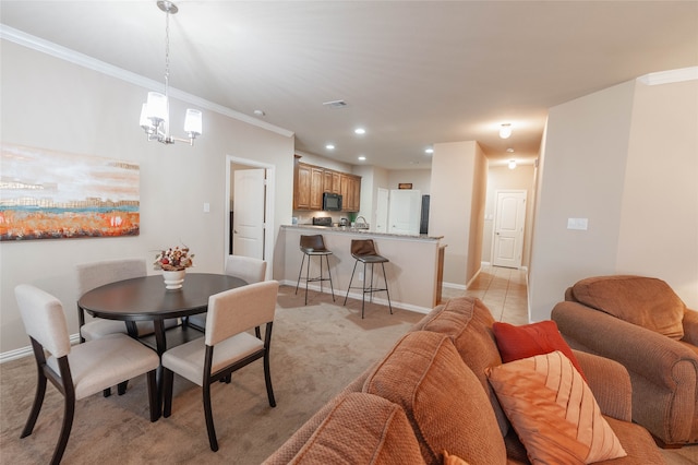 dining space featuring light tile patterned floors, an inviting chandelier, and ornamental molding