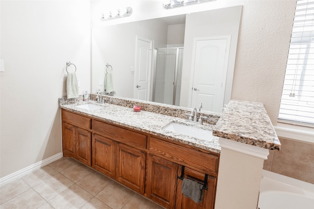 bathroom with tile patterned flooring, vanity, and an enclosed shower