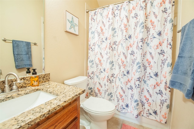 bathroom featuring a shower with shower curtain, tile patterned floors, vanity, and toilet