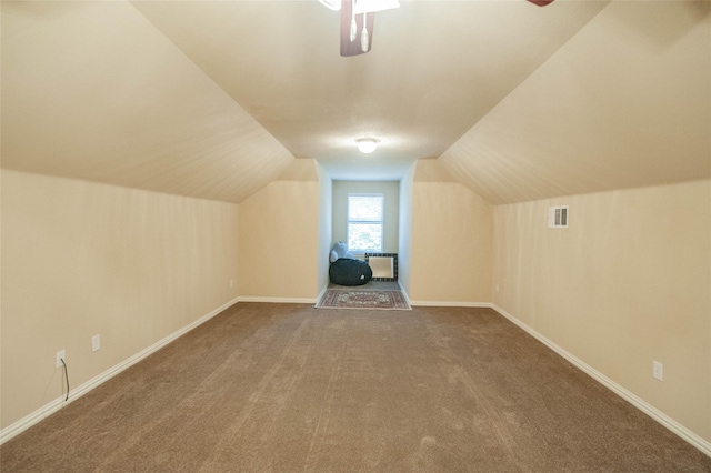 bonus room featuring lofted ceiling and carpet flooring