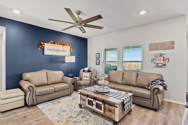 living room featuring hardwood / wood-style flooring and ceiling fan