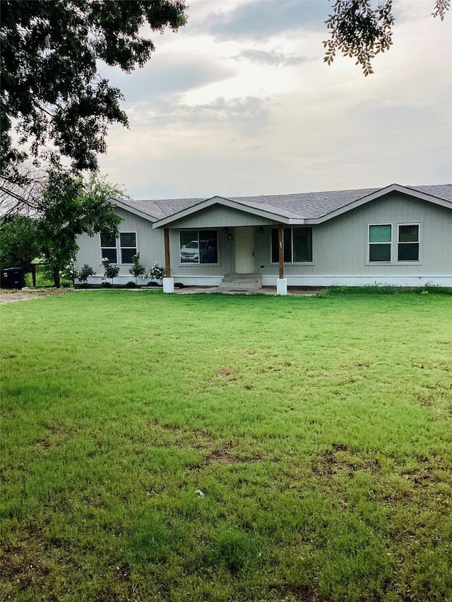 single story home featuring a front yard