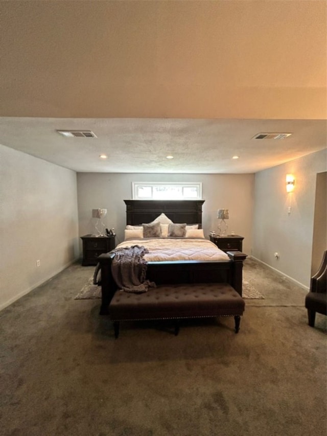 carpeted bedroom with a textured ceiling