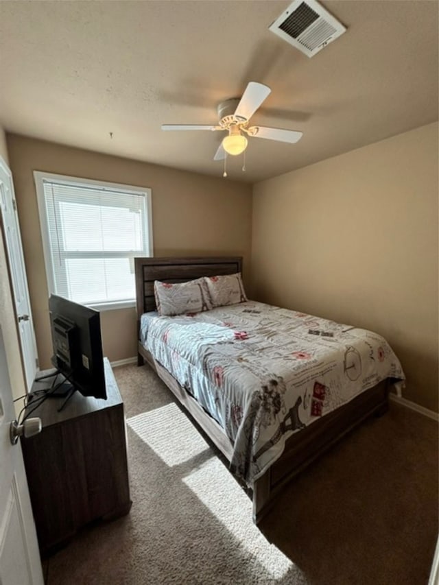 bedroom featuring ceiling fan and carpet floors