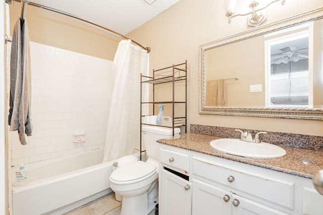 full bathroom with toilet, shower / tub combo with curtain, a textured ceiling, tile patterned flooring, and vanity