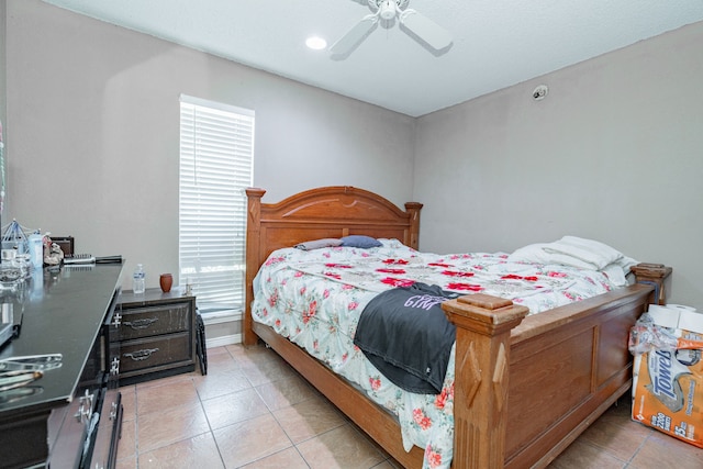 bedroom featuring ceiling fan and light tile patterned flooring