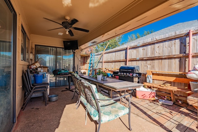 view of patio / terrace with ceiling fan and a grill