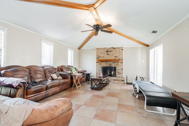 living room with lofted ceiling with beams, visible vents, a fireplace, and crown molding