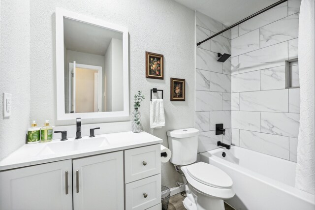 full bathroom featuring shower / bath combo with shower curtain, vanity, and toilet