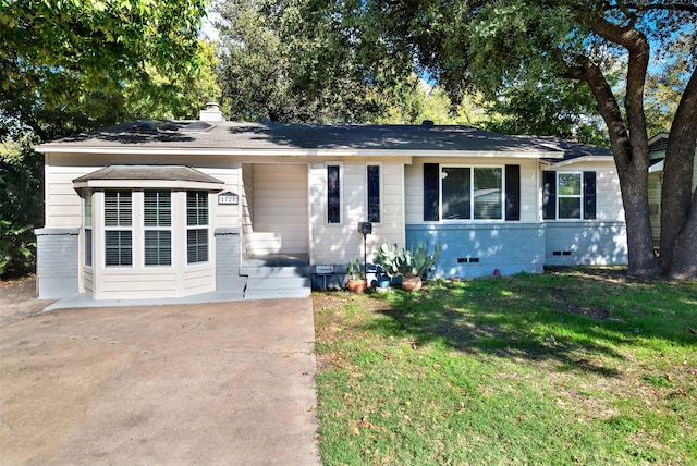 ranch-style house with a front yard